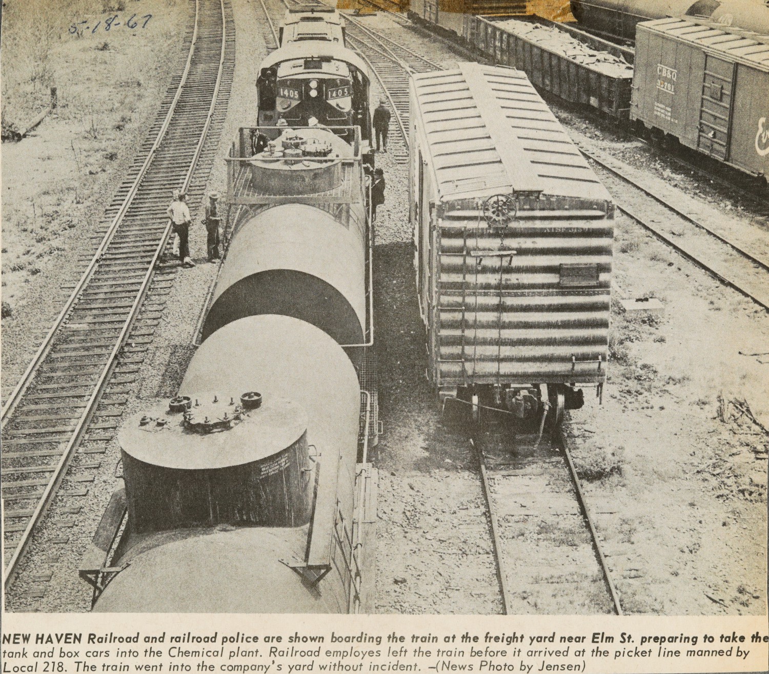NEW HAVEN Railroad and railroad police are shown boarding the train at the freight yard near Elm St. preparing to take tank and box cars into the Chemical plant. Railroad employees left the train before it entered the plant. Local 218. The train went into the company's yard without incident.