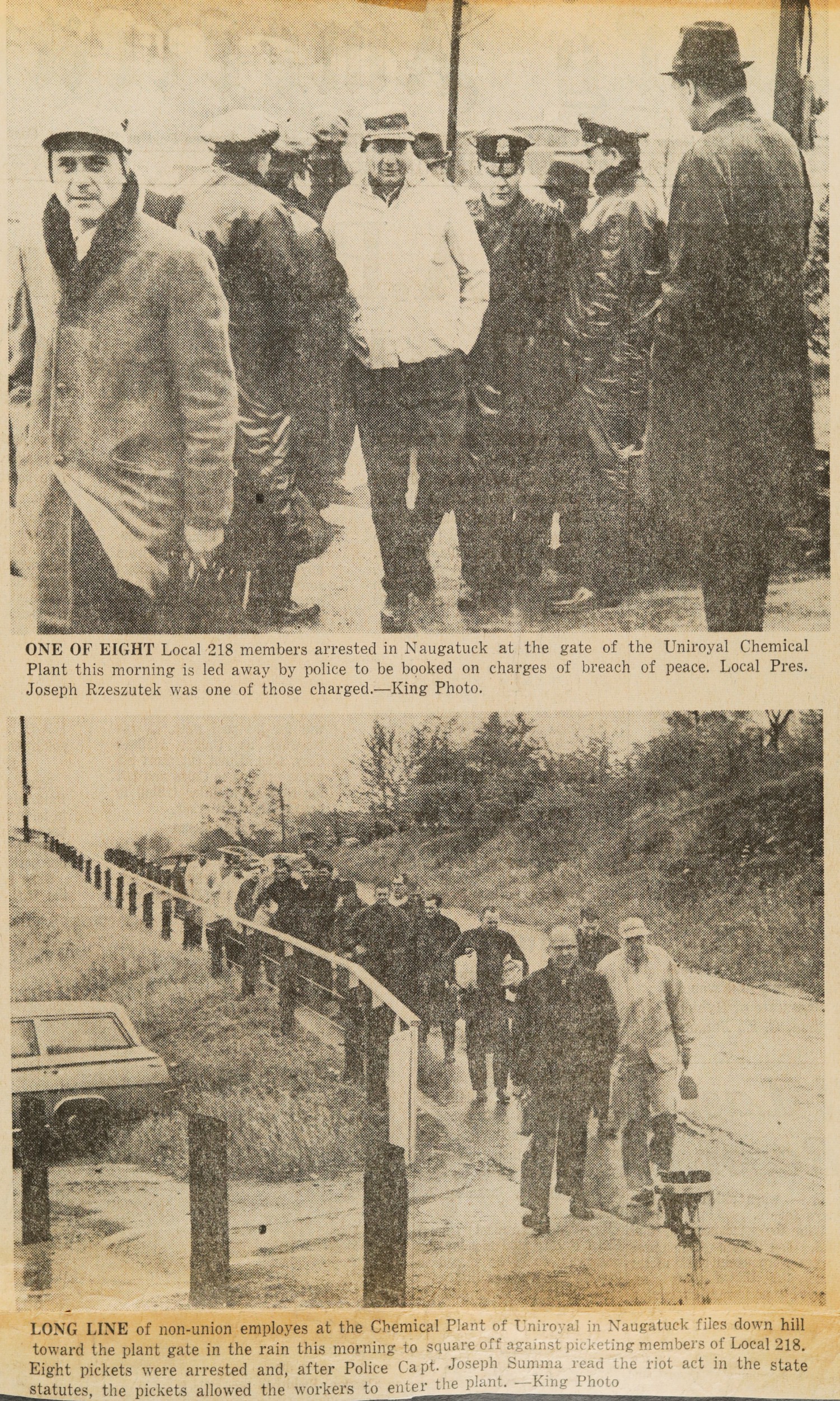 ONE OF EIGHT Local 218 members arrested in Naugatuck at the gate of the Uniroyal Chemical Plant this morning is led away by police to be booked on charges of breach of peace. Local Pres. Joseph Rzeszutek was one of those charged.