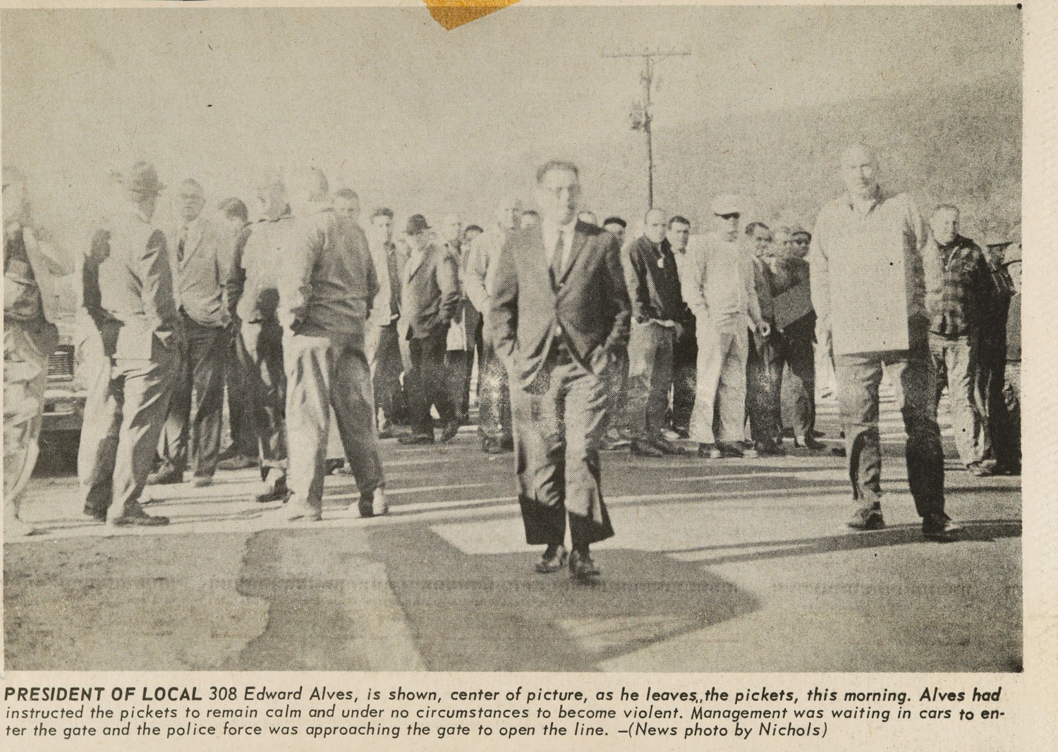 PRESIDENT OF LOCAL 308 Edward Alves, is shown, center of picture, as he leaves,the pickets, this morning. Alves had instructed the pickets to remain calm and under no circumstances to become violent. Management was waiting in cars to enter the gate and the police force was approaching the gate to open the line.