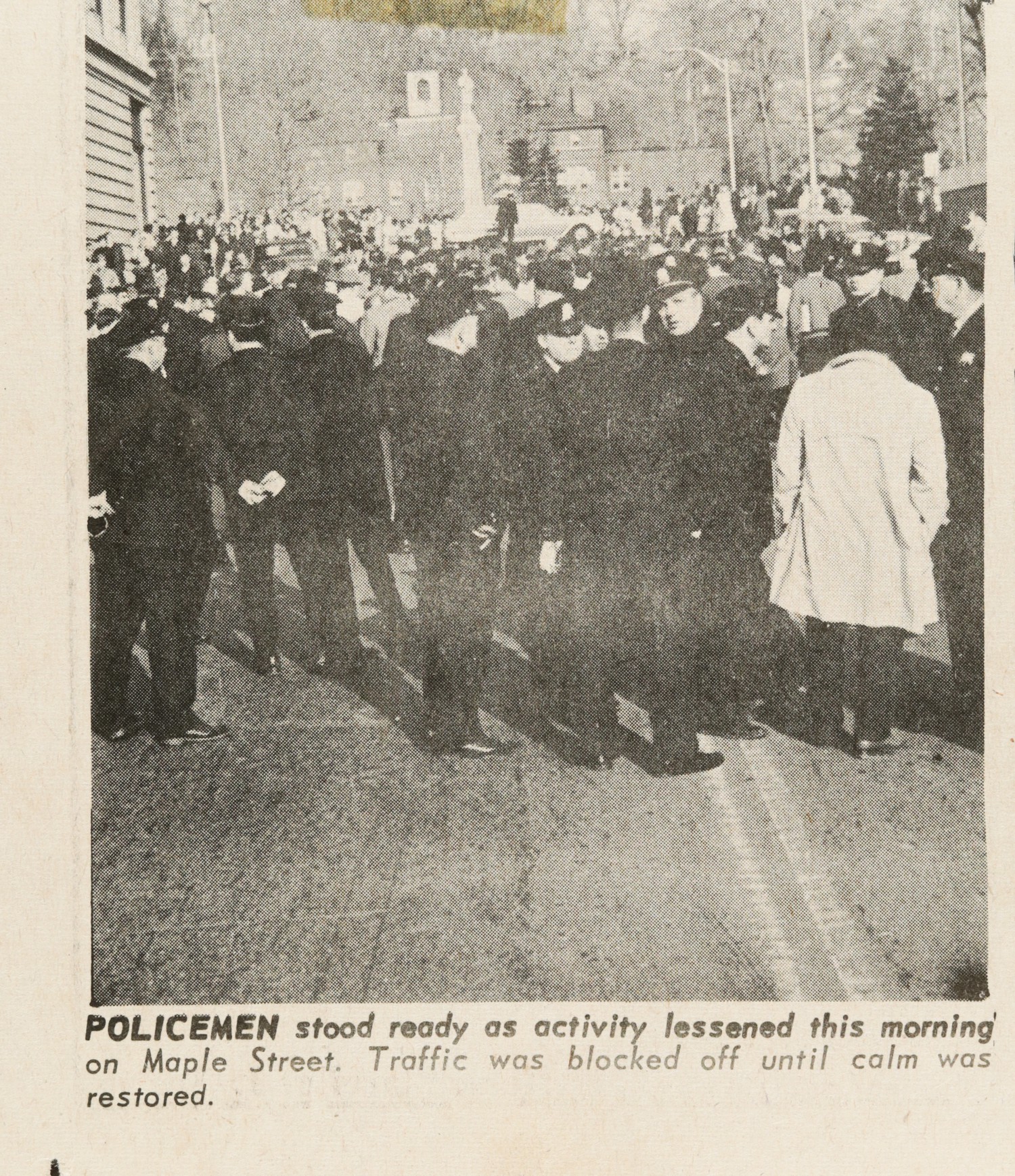 POLICEMEN stood ready as activity lessened this morning